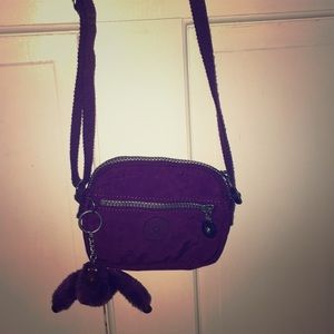 Kipling cross body bag, color is plum.